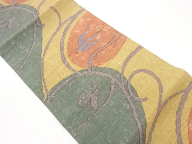 手織り紬抽象唐草に鳥模様開き名古屋帯（額縁仕立て）